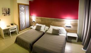 Postel nebo postele na pokoji v ubytování Hotel Joya