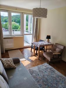 Χώρος καθιστικού στο Marea Apartament Przylesie Opera Leśna