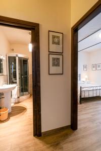 a hallway with a door leading to a living room at Casa Vacanze Villa Maria in Anghiari