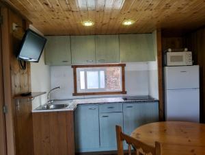 Kuchyň nebo kuchyňský kout v ubytování Càmping Terra Alta