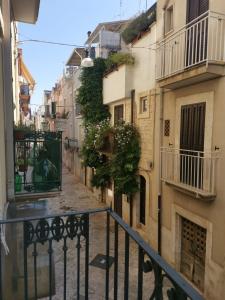 a view of an alley with buildings at Casa Camelia - Elegant Palace with Terrace - Conversano in Conversano