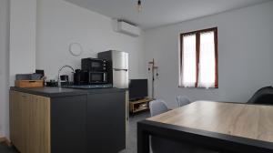 Kuchyň nebo kuchyňský kout v ubytování Ab gite et spa