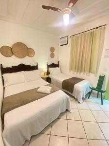 Postel nebo postele na pokoji v ubytování Casa Coco Verde Paraty