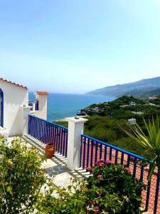 a balcony with a view of the ocean at Sea View Kerame in Evdilos