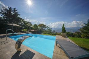 a swimming pool with a view of the mountains at Mountain Mansion Pool, Jacuzzi Epic Medellin View in Envigado