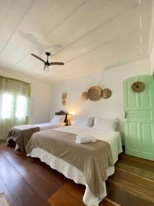 Postel nebo postele na pokoji v ubytování Casa Coco Verde Paraty