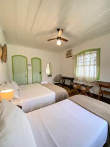 Postel nebo postele na pokoji v ubytování Casa Coco Verde Paraty