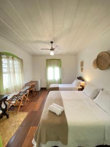 Postel nebo postele na pokoji v ubytování Casa Coco Verde Paraty