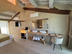 a bedroom with two sinks and a large mirror at Tenuta d'Arbia, Siena in Monteroni dʼArbia
