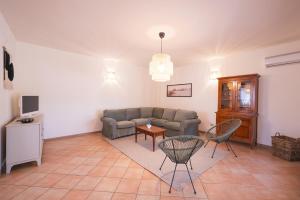 a living room with a couch and a table at House Levante 28 APT 1 in Pula