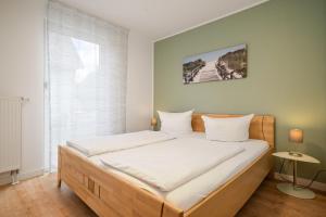 Postel nebo postele na pokoji v ubytování Ferienhaus Aurora mit Kamin und Terrasse