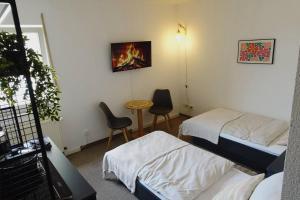 Postel nebo postele na pokoji v ubytování Aparthotel Zur Linde - by Willms & Schömer eG