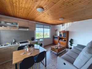 a living room with a table and a couch at Family's Peace in Kamiros