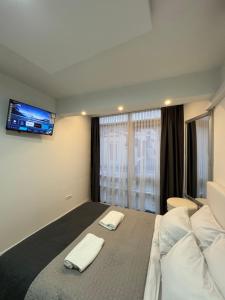 Una cama o camas en una habitación de Sarajevo Center Point
