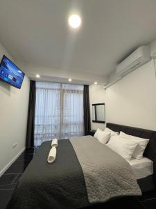 Una cama o camas en una habitación de Sarajevo Center Point