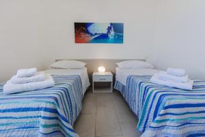 Katil atau katil-katil dalam bilik di Brezza di tramontana