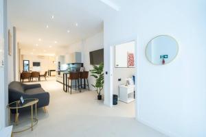 a living room with a couch and a table at Apt new Mestalla | jacuzzi | billar | ping pong in Valencia