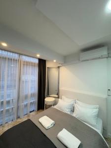 Una cama o camas en una habitación de Sarajevo Center Point