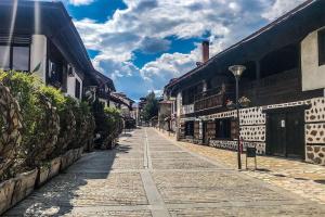 a cobblestone street in an old town with buildings at Downtown Bansko Luxury Resort in Bansko