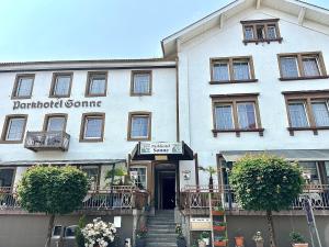 a white building with a sign that reads montestead gamma at Parkhotel Sonne in Schönau im Schwarzwald
