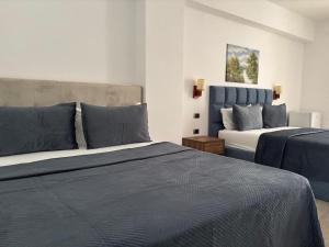 Postel nebo postele na pokoji v ubytování Grand Resort by Greccia Dhermi Prime