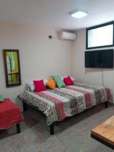 a room with a bed in a room at El Departamentito in Villa Mercedes