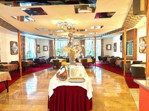 a large room with tables and chairs in it at Parkhotel Sonne in Schönau im Schwarzwald