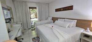 Postel nebo postele na pokoji v ubytování Top Apartamento Studio Iloa Residence + 30 fotografií
