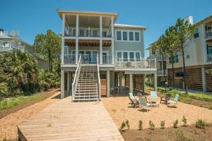 a house with a wooden walkway in front of it at Heaven's Walk in Indian Pass