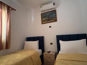 Postel nebo postele na pokoji v ubytování Grand Resort by Greccia Dhermi Prime
