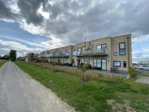 a large brick building on the side of a road at Convenient Apartment for 2 in Aarhus