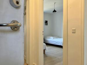 an open door to a bedroom with a bed at Convenient Apartment for 2 in Randers