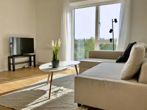 TV a/nebo společenská místnost v ubytování Spacious Apartment for 7 in Gellerupparken