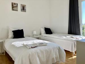 Postel nebo postele na pokoji v ubytování Spacious Apartment for 7 in Gellerupparken
