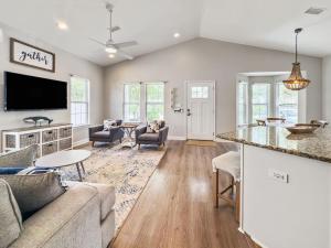 a living room with a couch and a table at Seagrove, 2 Bd , Sleeps 8, Stillwater 30A, Walk to Beach ,Pool in Santa Rosa Beach