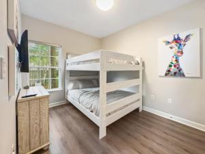 a bedroom with a bunk bed and a desk at Seagrove, 2 Bd , Sleeps 8, Stillwater 30A, Walk to Beach ,Pool in Santa Rosa Beach +26 photos
