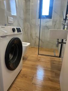 Koupelna v ubytování Dion apartamen