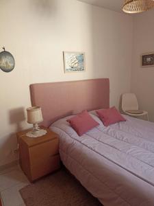 Postel nebo postele na pokoji v ubytování MAUGUIO-Carnon P2 60 m2, Tout confort, spacieux, CLIM, wifi, balcon, parking privé couvert, 15 min de la mer, de Montpellier