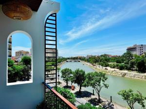 a view of a river from a building at Anriva Hoi An in Hoi An