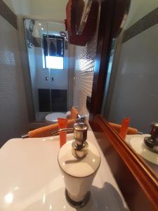 a bathroom with a sink and a mirror at Villa Rosa in Andria +20 photos