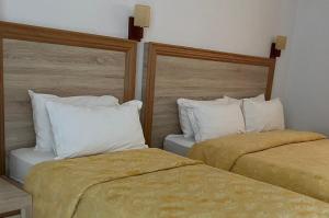 Postel nebo postele na pokoji v ubytování Grand Resort by Greccia Dhermi Prime