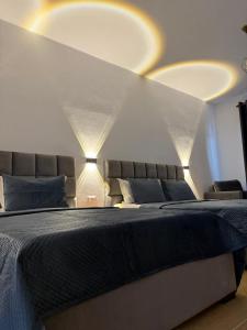 Postel nebo postele na pokoji v ubytování Grand Resort by Greccia Dhermi Prime