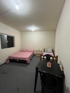 Ένα ή περισσότερα κρεβάτια σε δωμάτιο στο Hostel cabo frio