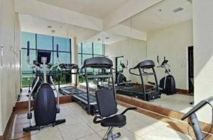 a gym with several exercise bikes in a room at Sunrise Oceanfront 2 Full Studio w/kitchen & pool in Daytona Beach