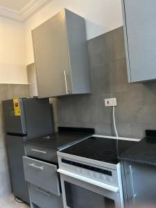 Kuchyň nebo kuchyňský kout v ubytování Saims Home + 2 fotografie