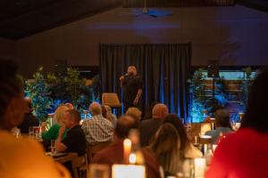 a man standing on a stage in a crowd of people at Black Prong Resort in Bronson +98 photos