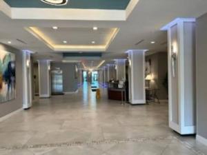 a hallway of a building with a lobby at Daytona Ocean View Modern Studio in Daytona Beach +37 photos