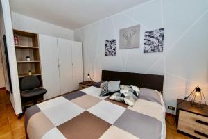 a bedroom with a bed and a desk and a chair at RobertONE guest house 14 in Bari