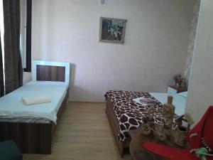 Postel nebo postele na pokoji v ubytování Akhaltsikhe hotel “Sunny House”