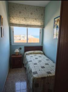 Postel nebo postele na pokoji v ubytování Apartamento frente al mar